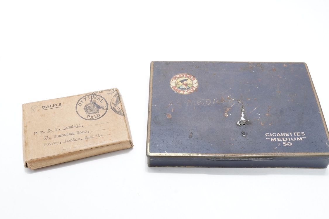 A First World War Mons Star trio awarded to Capt. A.D. Lowdell, with a clasp for 5th Aug-22nd Nov 1914, and oakleaf - mention in dispatches, together with the miniature set, plus a WWII Defence medal in its original card